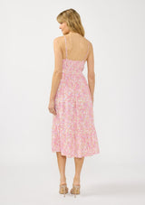 [Color: Natural/Dusty Rose] A back facing image of a blonde model wearing a pink floral midi dress with a v neckline, spaghetti straps, a smocked back, and side pockets.