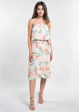 [Color: Blush/Green] A woman modeling a strapless top and matching midi skirt set with a pink and green tropical floral print paired with beige strappy high-heeled sandals.