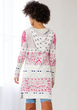 [Color: Orchid/Raspberry] A back facing image of a brunette model wearing a vibrant boho patterned knit cardigan with long cozy sleeves, open front, and hoodie. An effortless statement sweater for easy layering.  