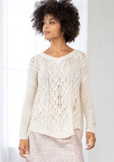 [Color: Vanilla] A front facing image of a brunette model wearing a lightweight cable knit pullover with open knit details. Featuring a classic round neckline, dropped shoulders, long sleeves, and a shirttail hem. Laid-back boho style for casual outings. 