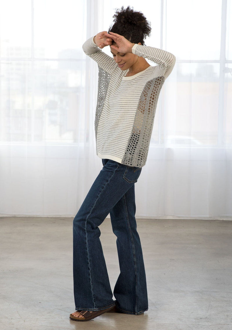 [Color: Grey/Ivory] A side facing image of brunette model wearing a boho striped pullover with a crochet accent.