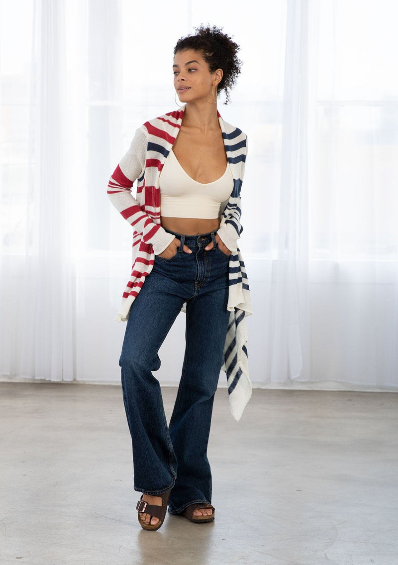 [Color: Ivory/Red/Blue] A brunette model wearing a red white and blue striped cardigan with a waterfall open front and long sleeves. A cozy light layer for casual outfits. 