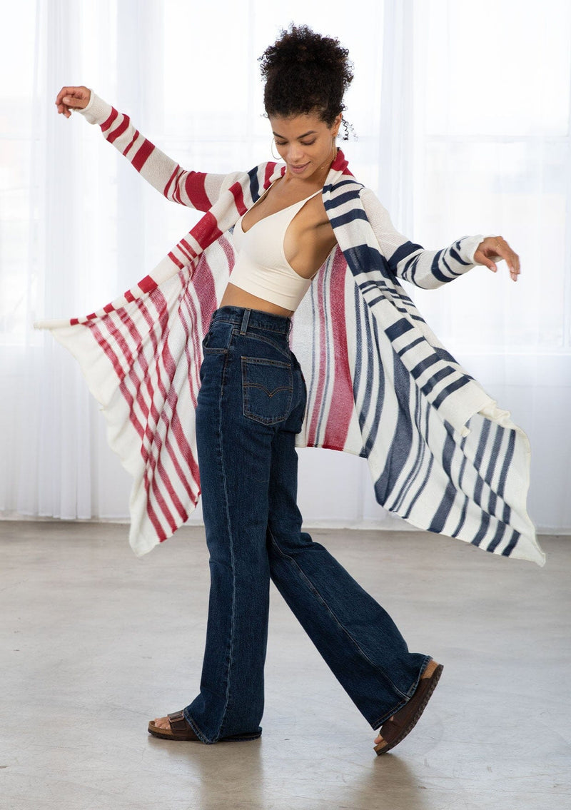 [Color: Ivory/Red/Blue] A brunette model wearing a red white and blue striped cardigan with a waterfall open front and long sleeves. A cozy light layer for casual outfits. 
