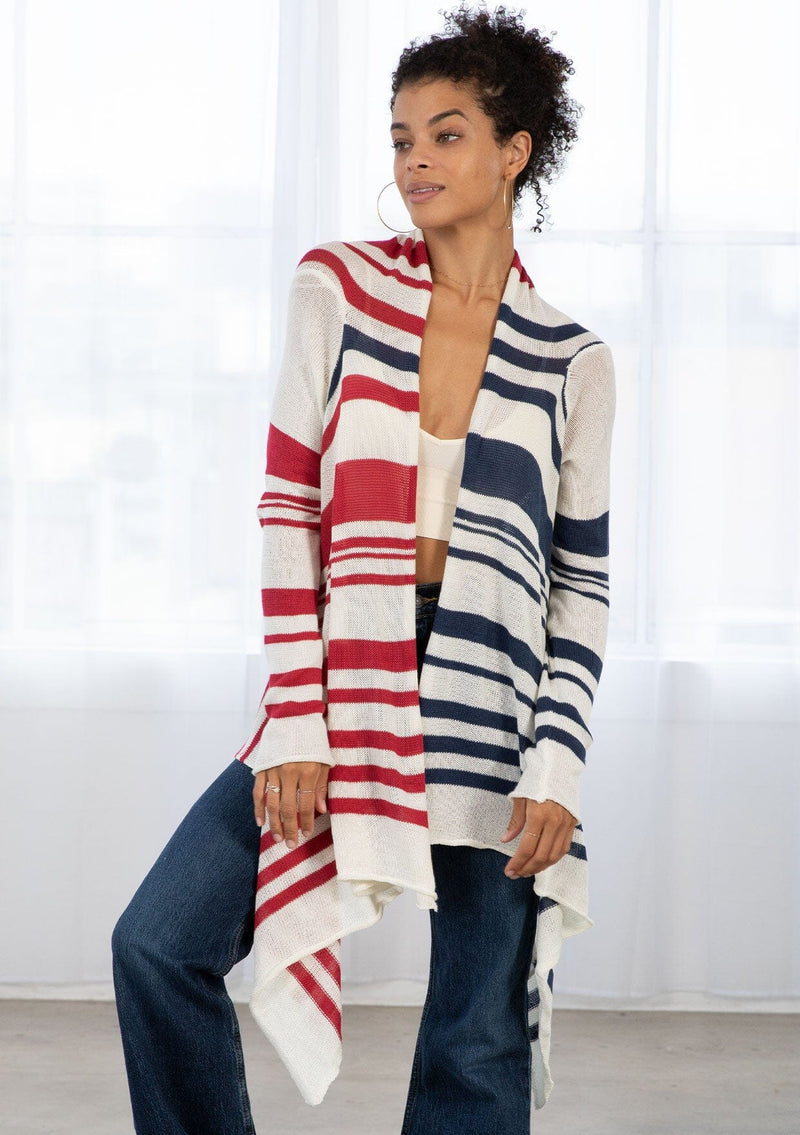 [Color: Ivory/Red/Blue] A brunette model wearing a red white and blue striped cardigan with a waterfall open front and long sleeves. A cozy light layer for casual outfits. 