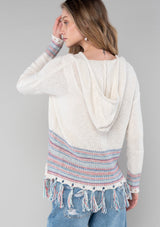 [Color: Off White/Navy] A white and blue bohemian fringed beach sweater with long sleeves and a hoodie. 