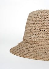 Beige woven bucket hat on a white background