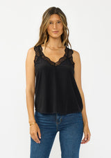 [Color: Black] Introducing our beloved lace trim camisole, now reimagined with elegant lace-trimmed straps and a sophisticated lace V-neckline. This versatile piece features a flattering racerback design with delicate pretty lace straps, making it the perfect layering essential.