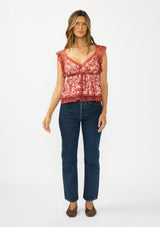 [Color: Wine/Dusty Rose] A front facing image of a brunette model wearing a wine floral print lace top with cap sleeves, v neckline, and a back button closure. 