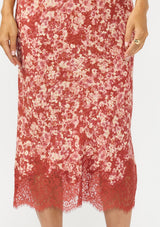 [Color: Wine/Dusty Rose] A front facing image of a red and white midi skirt with lace trim. 