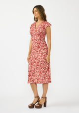 [Color: Wine/Dusty Rose] A side facing image of a brunette model wearing a wine floral print midi dress with a ruched bodice, v neckline, and short flutter sleeves. 