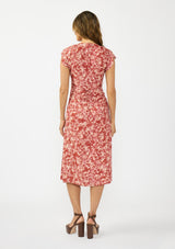 [Color: Wine/Dusty Rose] A back facing image of a brunette model wearing a wine floral print midi dress with a ruched bodice, v neckline, and short flutter sleeves. 