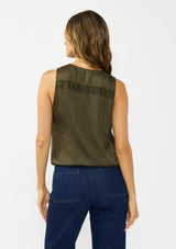 [Color: Olive] A back facing image of a brunette model wearing a olive green sleeveless top with an embroidered trim, elastic hem, and a surplice front. 
