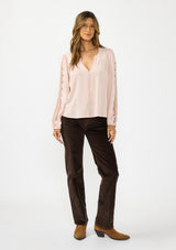 [Color: Shell] A front facing image of a brunette model wearing a pink embroidered top with mesh detail. Styled with a dark brown corduroy and camel boots.