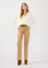 [Color: White] A front facing image of a blonde model wearing a white cozy rib stitch cardigan with a button front, v-neckline, ribbed border, and cable knit detailing along the sleeves. 