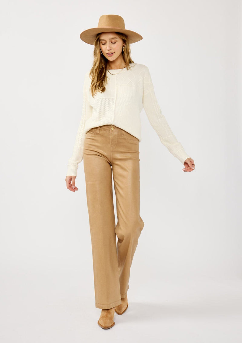 [Color: Cloud] A front facing image of a blonde model wearing a white cozy mix knit pullover sweater with a classic crew neckline. Lightweight and warm for casual outings or the office. 