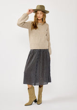 [Color: Heather Cement] A front facing image of a blonde model in a beige crewneck pullover sweater with ribbed blouson sleeves. A versatile knit ideal for styling with skirts or trousers for a chic, polished outfit.