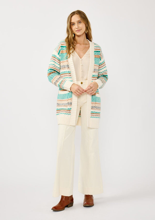 [Color: White/Green] A front facing image of a blonde model wearing a green and brown striped knit cardigan with a contrasting ribbed trim. Featuring long cozy sleeves and an open front for easy layering. A boho inspired cardigan for the fall season. 