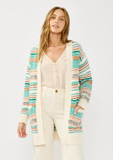 [Color: White/Green] A front facing image of a blonde model wearing a green and brown striped knit cardigan with a contrasting ribbed trim. Featuring long cozy sleeves and an open front for easy layering. A boho inspired cardigan for the fall season. 