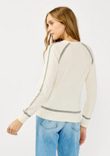 [Color: Cream/Heather Grey] A back facing image of a blonde model wearing a cream pullover sweater with a grey border stripe. Featuring long cozy sleeves, a classic crew neckline, and ribbed trimming. 