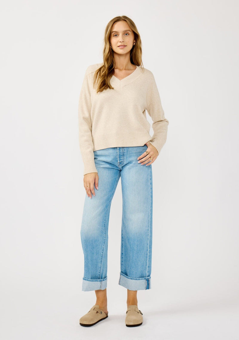 [Color: Heather Petal] A front facing image of a blonde model wearing a classic cozy v-neck pullover sweater with ribbed trims. Perfect for casual outings and the office. 