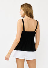 [Color: Black] A back facing image of a blonde model wearing a black boho tank top with a smocked back, button front, an eyelet trim, and pintuck details. Perfect for everyday warm weather styling. 