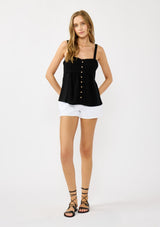 [Color: Black] A front facing image of a blonde model wearing a black boho tank top with a smocked back, button front, an eyelet trim, and pintuck details. Perfect for everyday warm weather styling. 