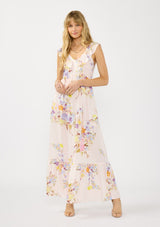 [Color: Blush/Dusty Blue] A front facing image of a blonde model wearing a pink floral print maxi dress with ruffled sleeves, adjustable straps, and side pockets. 