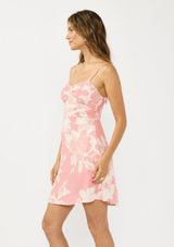 [Color: Salmon/Ivory] A side facing image of a pink floral mini dress with a sweetheart neckline, spaghetti straps, side pockets, and a smocked back. 