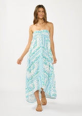 [Color: Natural/Mint] A front facing image of a brunette model wearing a sleeveless mint green floral maxi dress with a tiered silhouette, high low hemline, ruffle trims, and side pockets. 