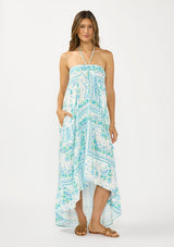 [Color: Natural/Mint] A front facing image of a brunette model wearing a mint green floral maxi dress with a halter neckline, tiered silhouette, high low hemline, ruffle trims, and side pockets. 