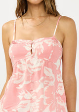 [Color: Salmon/Ivory] A detail image of a brunette model wearing a pink and ivory cami with spaghetti straps and a button front. 
