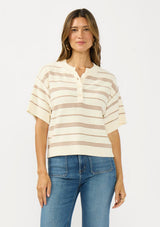 [Color: Vanilla/Taupe] A front facing image of a brunette model wearing an ivory and beige cotton striped sweater top with short sleeves and a button front. 