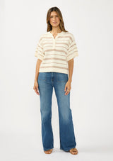 [Color: Vanilla/Taupe] A front facing image of a brunette model wearing an ivory and beige cotton striped sweater top with short sleeves and a button front. 