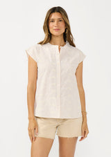 [Color: Tan/Natural] A front facing image of a brunette model wearing a checkered button front top with cap sleeves and floral embroidery. 