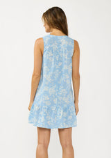 [Color: Blue/Ivory] A back facing image of a brunette model wearing a blue floral sleeveless mini dress with a split v neckline and side pockets.  