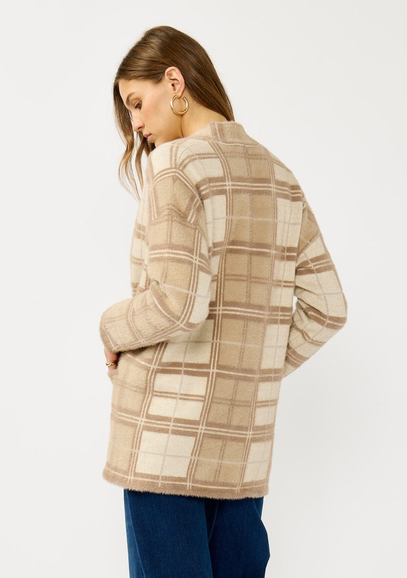 [Color: Tan/Mocha] A back facing image of a blonde model wearing a brown plaid cardigan with cozy long sleeves and an open front. A warm fuzzy sweater for the fall season. 