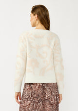 [Color: Ivory/Light Blush] A back facing image of a blonde model wearing cozy knit sweater with a floral jacquard pattern. Featuring a classic crew neckline, cozy long sleeves, and ribbed trims. A fall trending sweater for cold weather styling. 