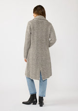 [Color: Taupe/Cream] A back facing image of a brunette model wearing a cozy and soft herringbone sweater coat with a notched lapel, button front, and patch pockets. 