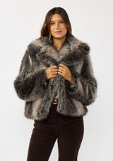 [Color: Charcoal] A front facing image of a brunette model wearing an ombre charcoal faux fur coat with a chic collar and cozy fit. Perfect for fall to winter styling. 