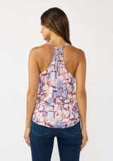[Color: Natural/Dusty Blue] A back facing image of a brunette model wearing a pink and blue floral tank top with a tie back and racerback detail. A flowy chiffon top for the fall season. 