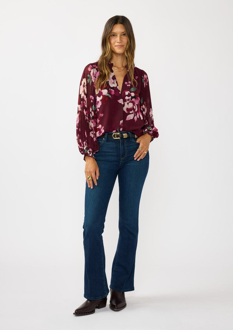 [Color: Wine/Dusty Rose] A front facing image a brunette model wearing a burgundy floral blouse with long voluminous pleated sleeves, split v-neckline, and a hidden button front. Perfect for the office, holidays, or other special occasions. 