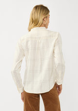 [Color: Natural/Silver] A back facing image of a blonde model wearing an off white windowpane shirt with metallic thread details. Featuring a collared neckline, button front, and button button cuff closure. A western influence shirt for the fall season. 
