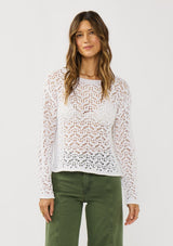 [Color: White] A front facing image of a brunette model wearing a white crochet knit top with a round neckline and long sleeves. A breezy pullover for the beach or casual outings. 