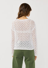 [Color: White] A back facing image of a brunette model wearing a white crochet knit top with a round neckline and long sleeves. A breezy pullover for the beach or casual outings. 