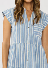 [Color: Blue/White] A detail image of a brunette model wearing a blue striped mini dress with tiered skirt, short dolman sleeves, collared neckline, button front, and a single patch pocket. 