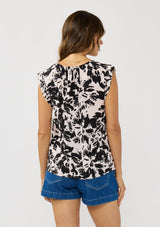 [Color: Vanilla/Black] A back facing image of a brunette model wearing an abstract floral print top with cap sleeves and a split v-neckline with ties. 