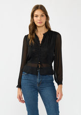 [Color: Black] A front facing image of a brunette model wearing a sheer black top with a front lace accent, button front, long sleeves, and a tie front waist detail. 