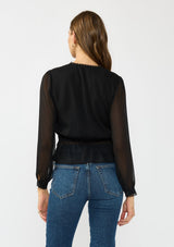 [Color: Black] A back facing image of a brunette model wearing a sheer black top with a front lace accent, button front, long sleeves, and a tie front waist detail. 