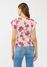 [Color: Coral/Wine] A baclk facing image of a brunette model wearing a pink and wine floral print top with a ruched center, short flutter sleeves, a tie back, and a v neckline. 