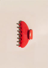 [Color: Cherry] An image of a large red hair claw clip from Nat and Noor. 